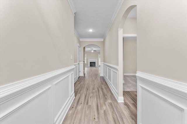 5921 Big Pond Trl, Grovetown, GA 30813 - corridor with ornamental molding, arched walkways, a wainscoted wall, light wood finished floors, and a decorative wall