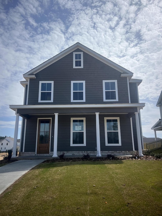 view of front facade with a porch and a front yard