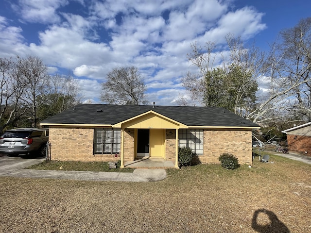 view of front facade featuring brick siding