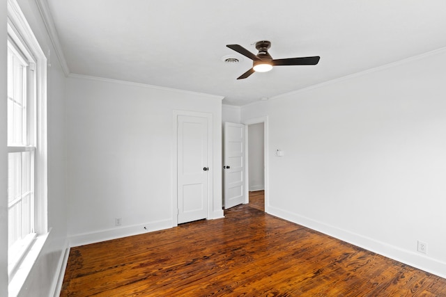 1611 Monte Sano Ave, Augusta, GA 30904 - empty room featuring ceiling fan, crown molding, baseboards, dark wood-style flooring, and healthy amount of natural light
