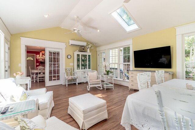 1300 Concord Ave, North Augusta, SC 29841 - living area featuring a wall mounted air conditioner, a chandelier, vaulted ceiling, a skylight, and wood finished floors