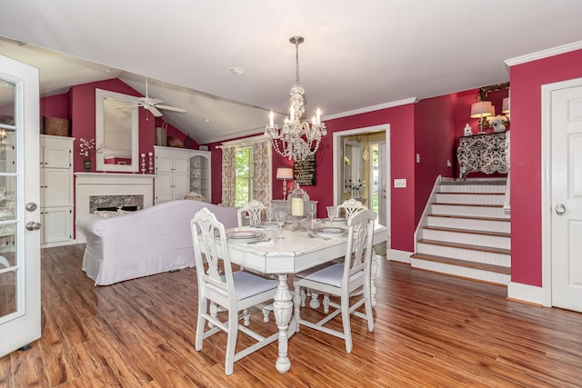 1300 Concord Ave, North Augusta, SC 29841 - dining room with a chandelier, wood finished floors, ceiling fan, a fireplace, and ornamental molding