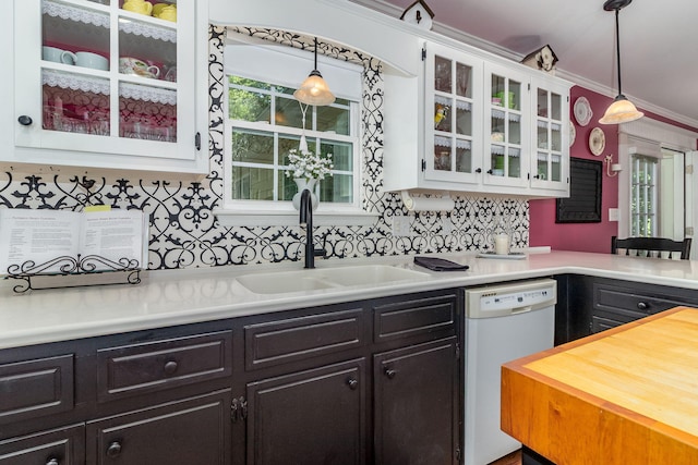 1300 Concord Ave, North Augusta, SC 29841 - kitchen featuring white dishwasher, light countertops, white cabinetry, a sink, and plenty of natural light