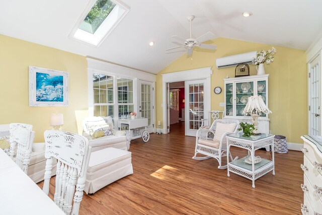 1300 Concord Ave, North Augusta, SC 29841 - living room with a wall mounted air conditioner, a skylight, vaulted ceiling, light wood-style flooring, and a ceiling fan