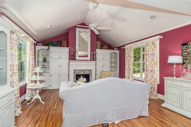 1300 Concord Ave, North Augusta, SC 29841 - bedroom with multiple windows, vaulted ceiling, a fireplace, wood finished floors, and crown molding