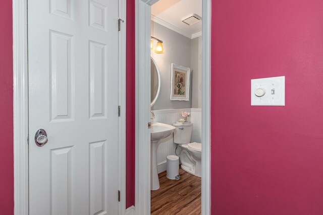 1300 Concord Ave, North Augusta, SC 29841 - half bathroom featuring crown molding, wood finished floors, toilet, and wainscoting