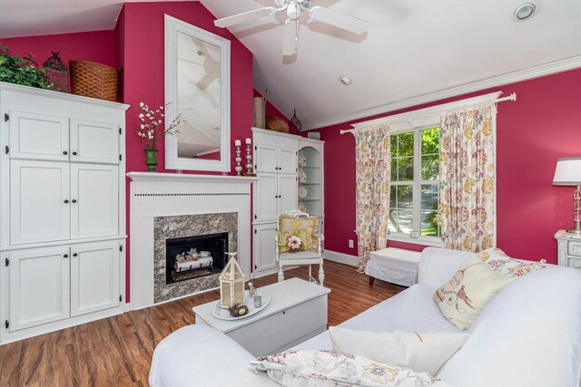 1300 Concord Ave, North Augusta, SC 29841 - living room featuring vaulted ceiling, a ceiling fan, dark wood finished floors, a high end fireplace, and ornamental molding