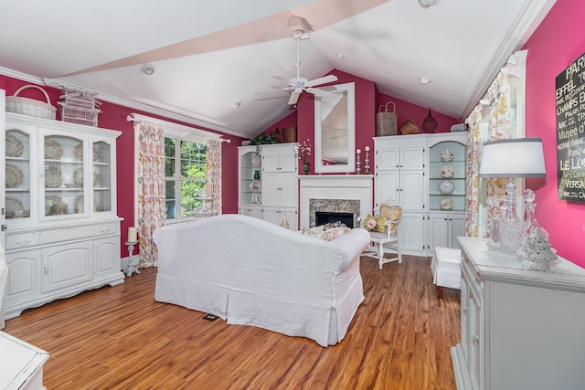 1300 Concord Ave, North Augusta, SC 29841 - living room with wood finished floors, a ceiling fan, a premium fireplace, ornamental molding, and lofted ceiling