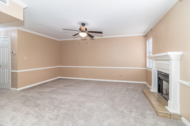 unfurnished living room with a tile fireplace, light carpet, ceiling fan, and ornamental molding