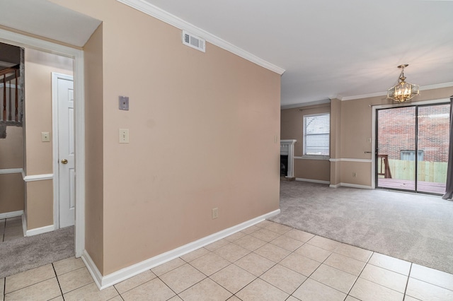 unfurnished room with light carpet, a chandelier, and ornamental molding