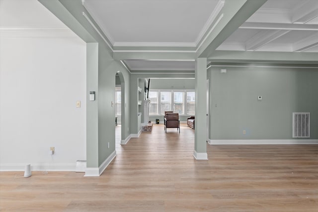 interior space with crown molding, coffered ceiling, beam ceiling, and light hardwood / wood-style flooring