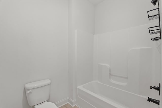 bathroom with bathtub / shower combination and toilet