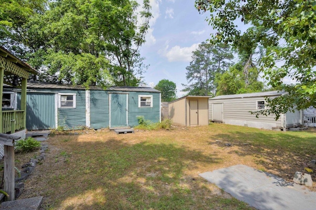 2011 Denmark Dr, Augusta, GA 30906 - view of yard featuring a storage unit and an outdoor structure