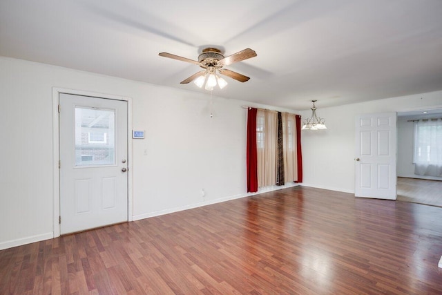 2011 Denmark Dr, Augusta, GA 30906 - unfurnished living room with baseboards, wood finished floors, and ceiling fan with notable chandelier