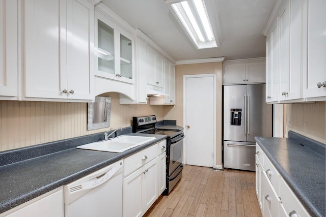 2011 Denmark Dr, Augusta, GA 30906 - kitchen featuring white cabinets, dark countertops, appliances with stainless steel finishes, a sink, and light wood-style flooring