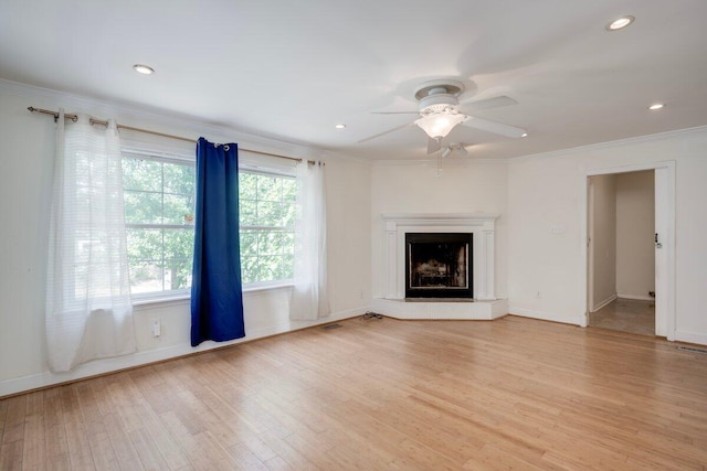 2011 Denmark Dr, Augusta, GA 30906 - unfurnished living room featuring crown molding, a ceiling fan, light wood-style flooring, and baseboards