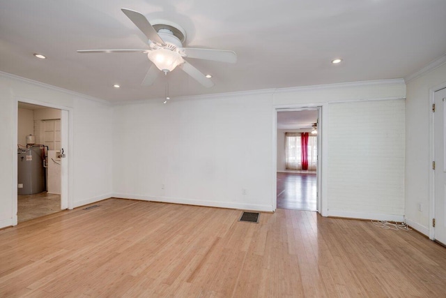 2011 Denmark Dr, Augusta, GA 30906 - unfurnished room featuring crown molding, ceiling fan, light wood-style flooring, visible vents, and electric water heater