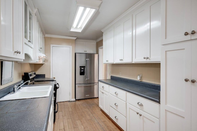2011 Denmark Dr, Augusta, GA 30906 - kitchen with white cabinets, high end fridge, dark countertops, a sink, and light wood-style flooring