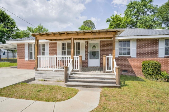 2011 Denmark Dr, Augusta, GA 30906 - view of front of property with covered porch, a front yard, metal roof, and brick siding