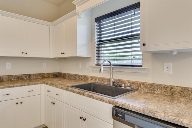 863 Westlawn Dr, Grovetown, GA 30813 - kitchen featuring a sink, dishwashing machine, white cabinetry, and plenty of natural light