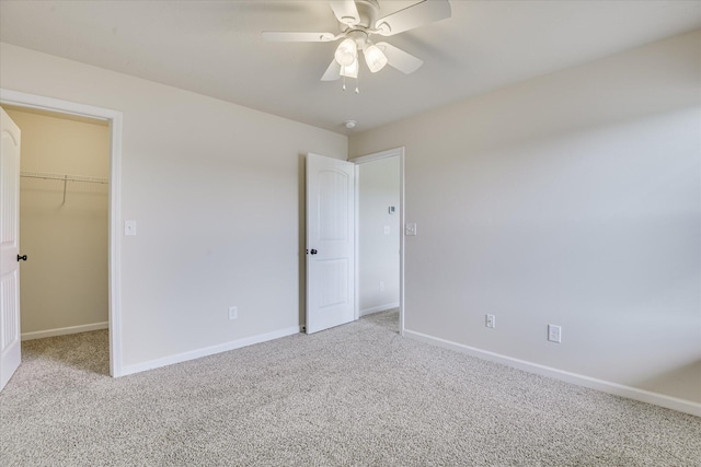 863 Westlawn Dr, Grovetown, GA 30813 - unfurnished bedroom featuring light colored carpet, a spacious closet, baseboards, a ceiling fan, and a closet