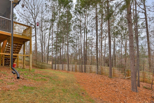 view of yard featuring a wooden deck