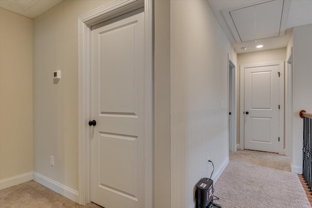 corridor featuring ornamental molding and light carpet