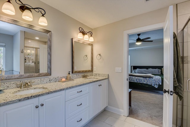 bathroom with ceiling fan, vanity, tile patterned flooring, and a shower with shower door