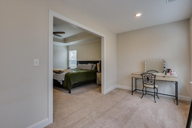 bedroom featuring crown molding and light carpet