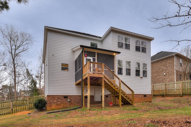 back of house with a sunroom