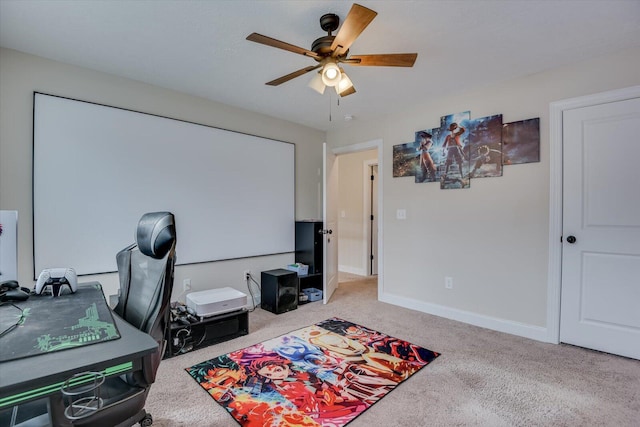 carpeted office space with ceiling fan