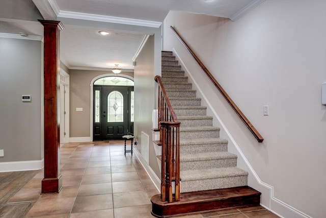 2288 William Few Pkwy, Evans, GA 30809 - entrance foyer featuring decorative columns, ornamental molding, stairway, baseboards, and light tile patterned flooring