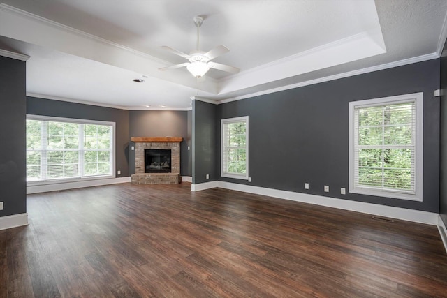 2288 William Few Pkwy, Evans, GA 30809 - unfurnished living room with a raised ceiling, dark wood finished floors, a ceiling fan, ornamental molding, and baseboards