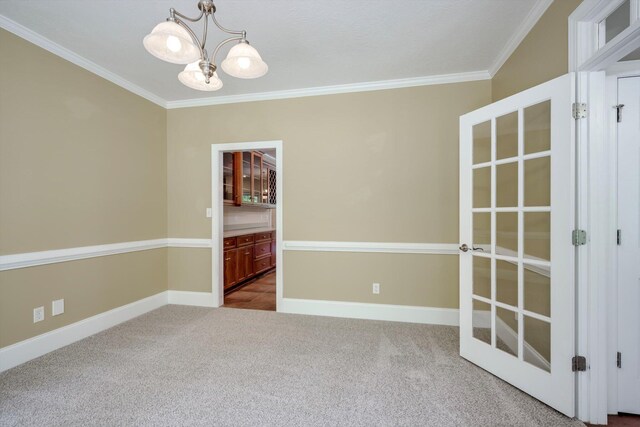 2288 William Few Pkwy, Evans, GA 30809 - empty room featuring a chandelier, ornamental molding, carpet floors, and baseboards