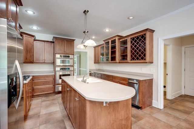 2288 William Few Pkwy, Evans, GA 30809 - kitchen featuring a sink, appliances with stainless steel finishes, light countertops, a kitchen island with sink, and glass insert cabinets