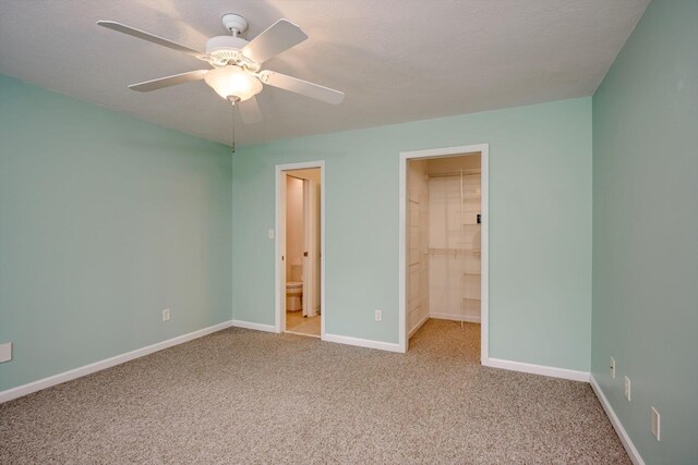 2288 William Few Pkwy, Evans, GA 30809 - unfurnished bedroom with carpet, baseboards, a spacious closet, and connected bathroom