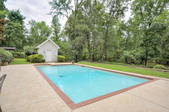2288 William Few Pkwy, Evans, GA 30809 - outdoor pool with a yard, a patio area, an outbuilding, and view of wooded area