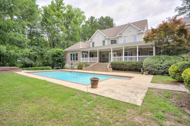 2288 William Few Pkwy, Evans, GA 30809 - back of house with a yard, a patio area, an outdoor pool, and brick siding