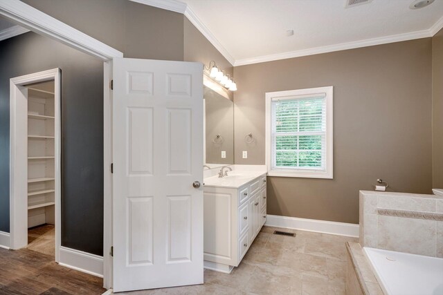 2288 William Few Pkwy, Evans, GA 30809 - bathroom with ornamental molding, vanity, a bath, and baseboards