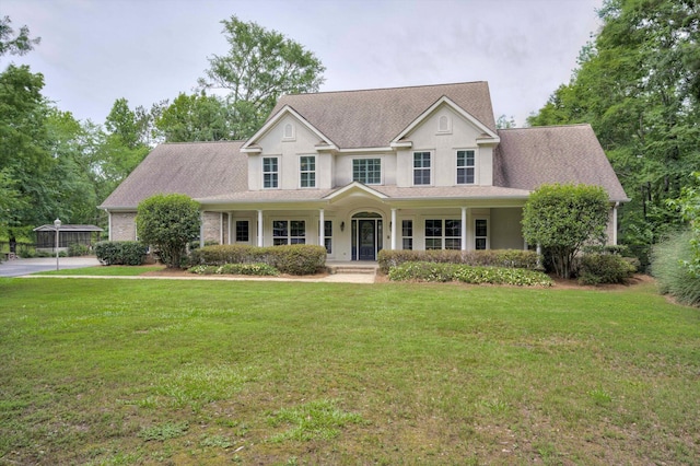 2288 William Few Pkwy, Evans, GA 30809 - view of front facade featuring covered porch and a front yard