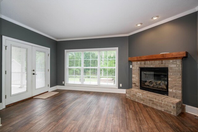 2288 William Few Pkwy, Evans, GA 30809 - unfurnished living room with wood finished floors, french doors, baseboards, a fireplace, and crown molding