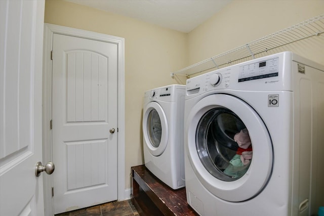 clothes washing area featuring washing machine and dryer