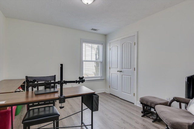 home office featuring light hardwood / wood-style floors