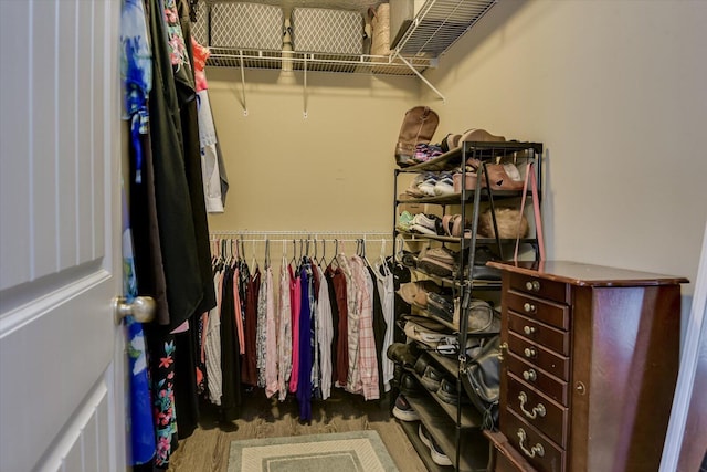 walk in closet featuring dark hardwood / wood-style flooring