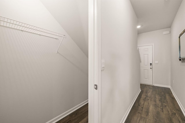 corridor featuring dark hardwood / wood-style floors