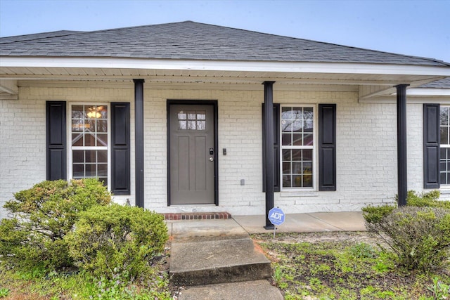 entrance to property featuring a porch