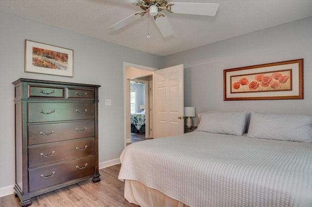 bedroom with light wood-type flooring and ceiling fan