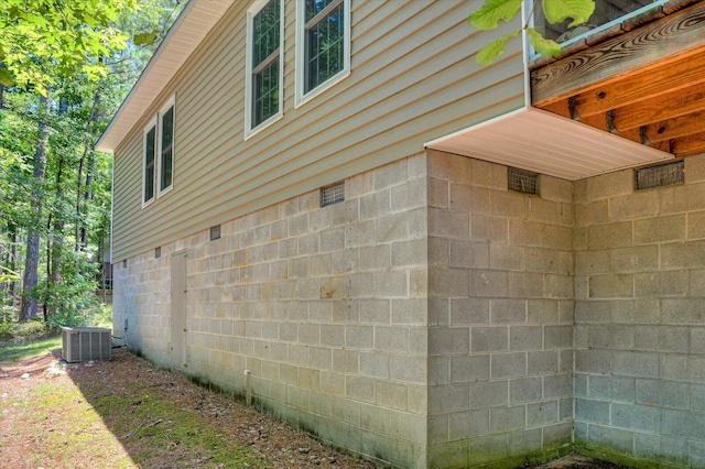 view of side of property featuring central AC