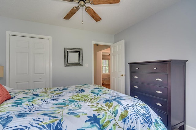 bedroom featuring ceiling fan and a closet