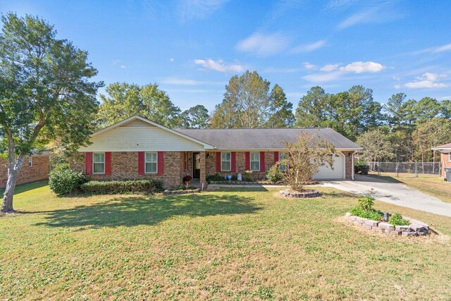 single story home with a garage and a front yard